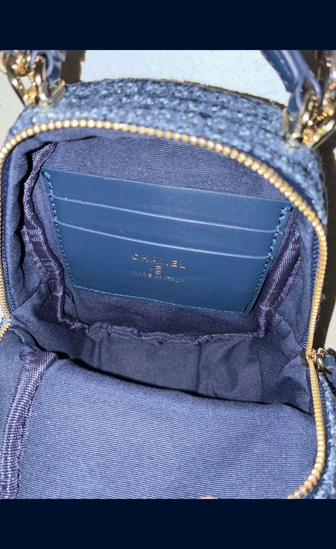 CHANEL backpack in navy tweed material with a quilted design.